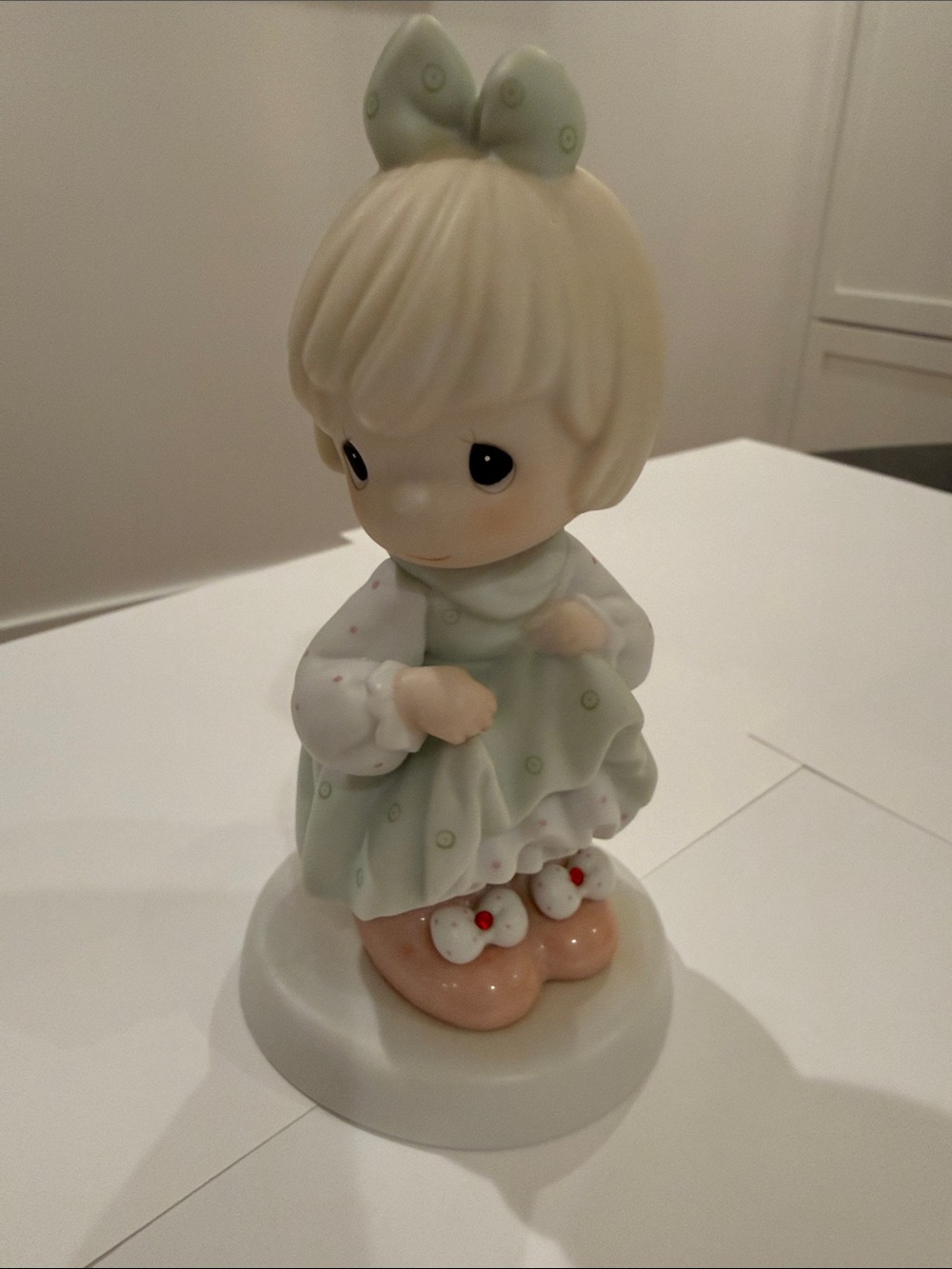 Precious Moments Figurine with Pale Green Dress and Bow Wearing Pink Shoes
